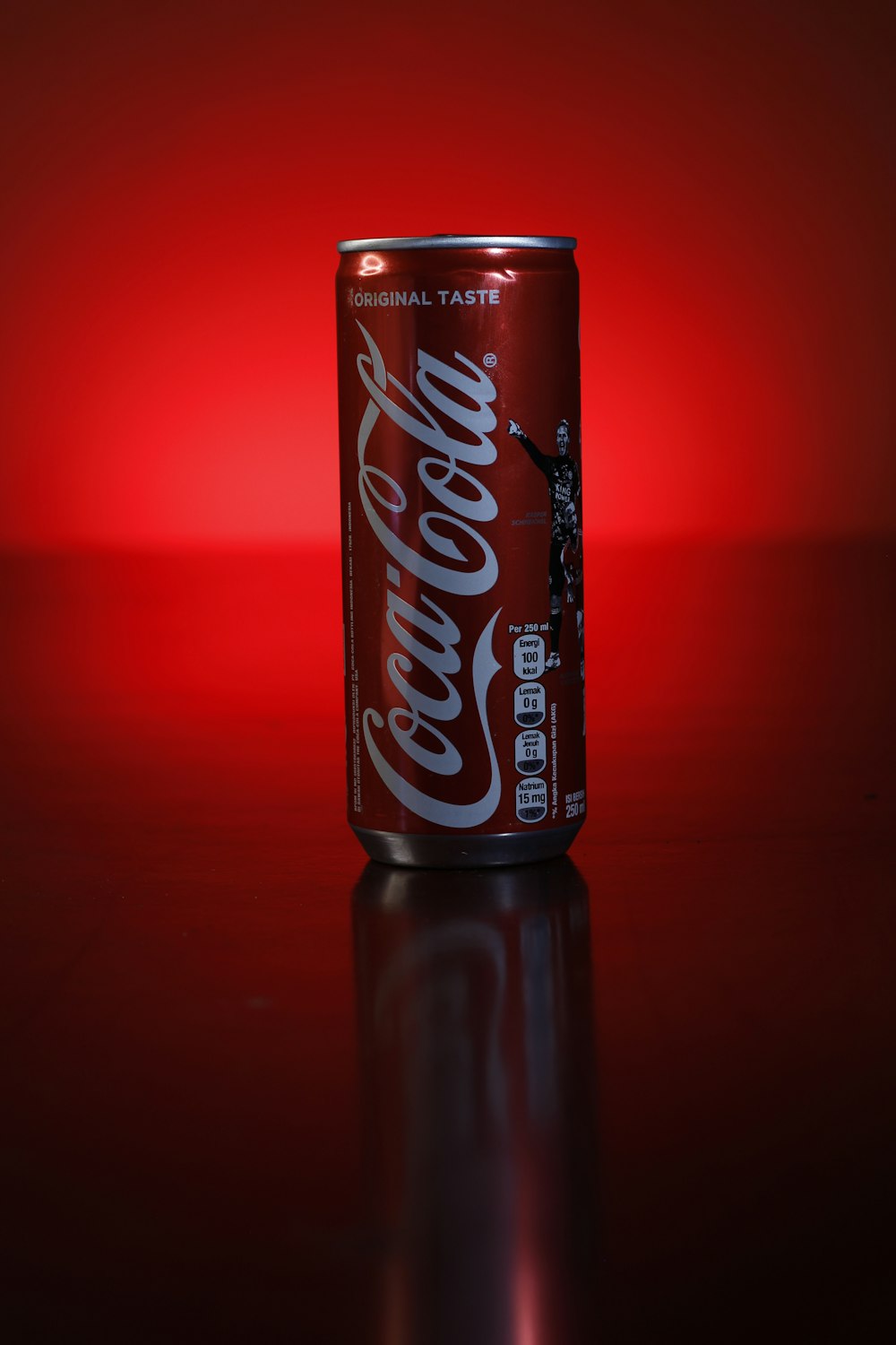 coca cola zero can on red surface