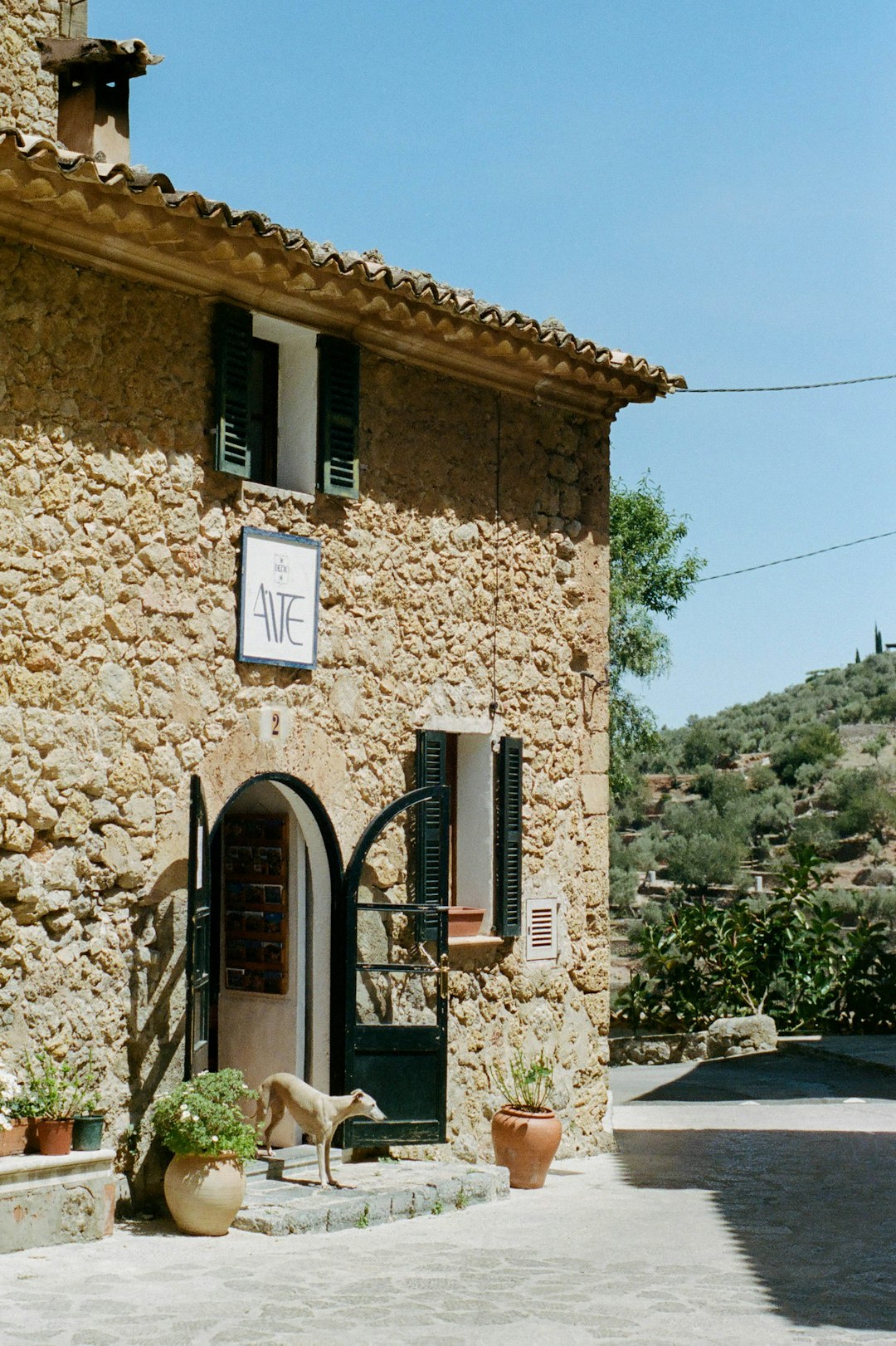 brown brick building with black wooden door