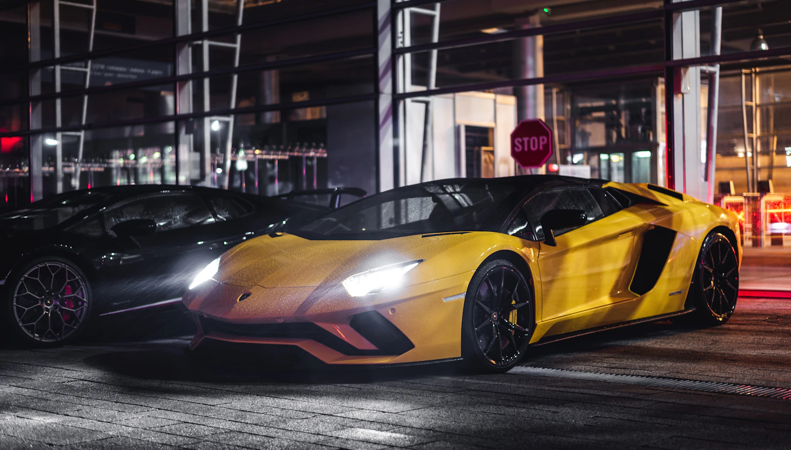 Yellow Lamborghini Aventador parked street-side in daylight — daily and weekly rentals