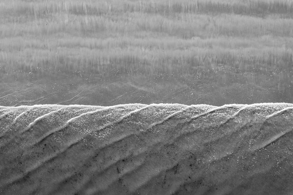 gray scale photo of sand