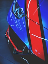 red and blue car in a dark room
