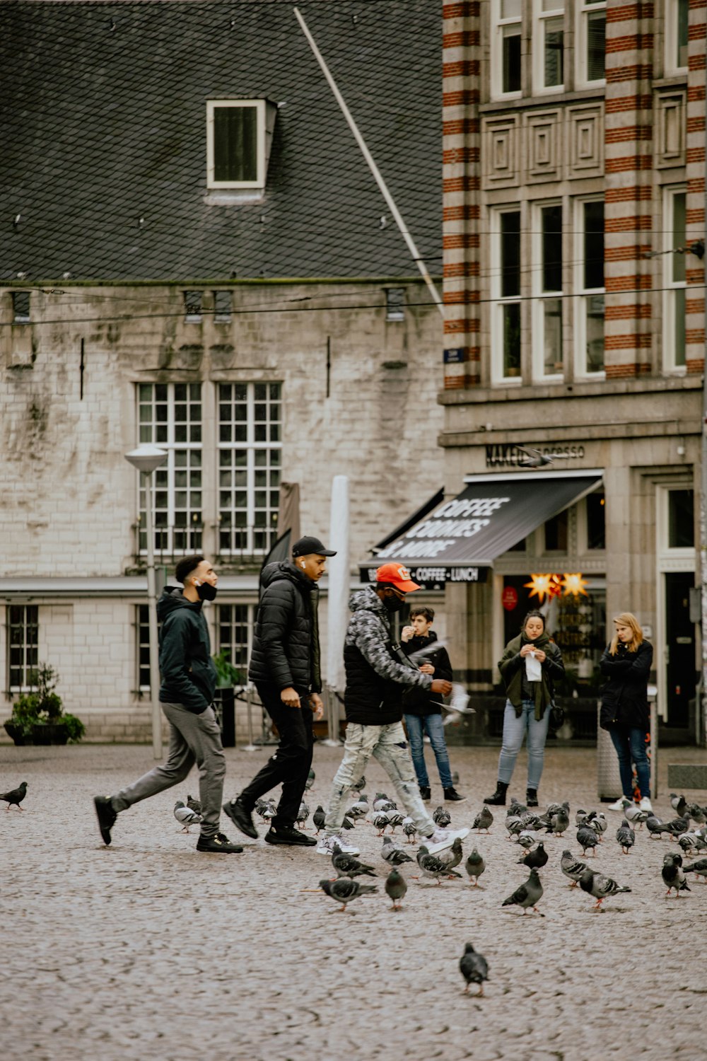 people playing ice hockey on street during daytime