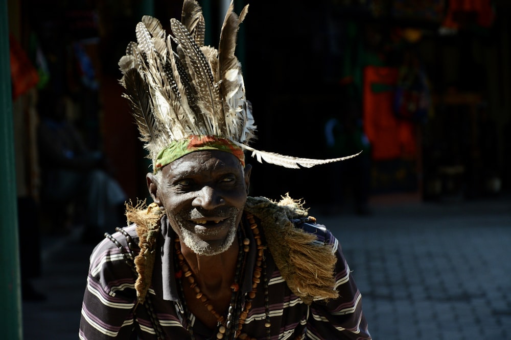 man in black and white feather costume