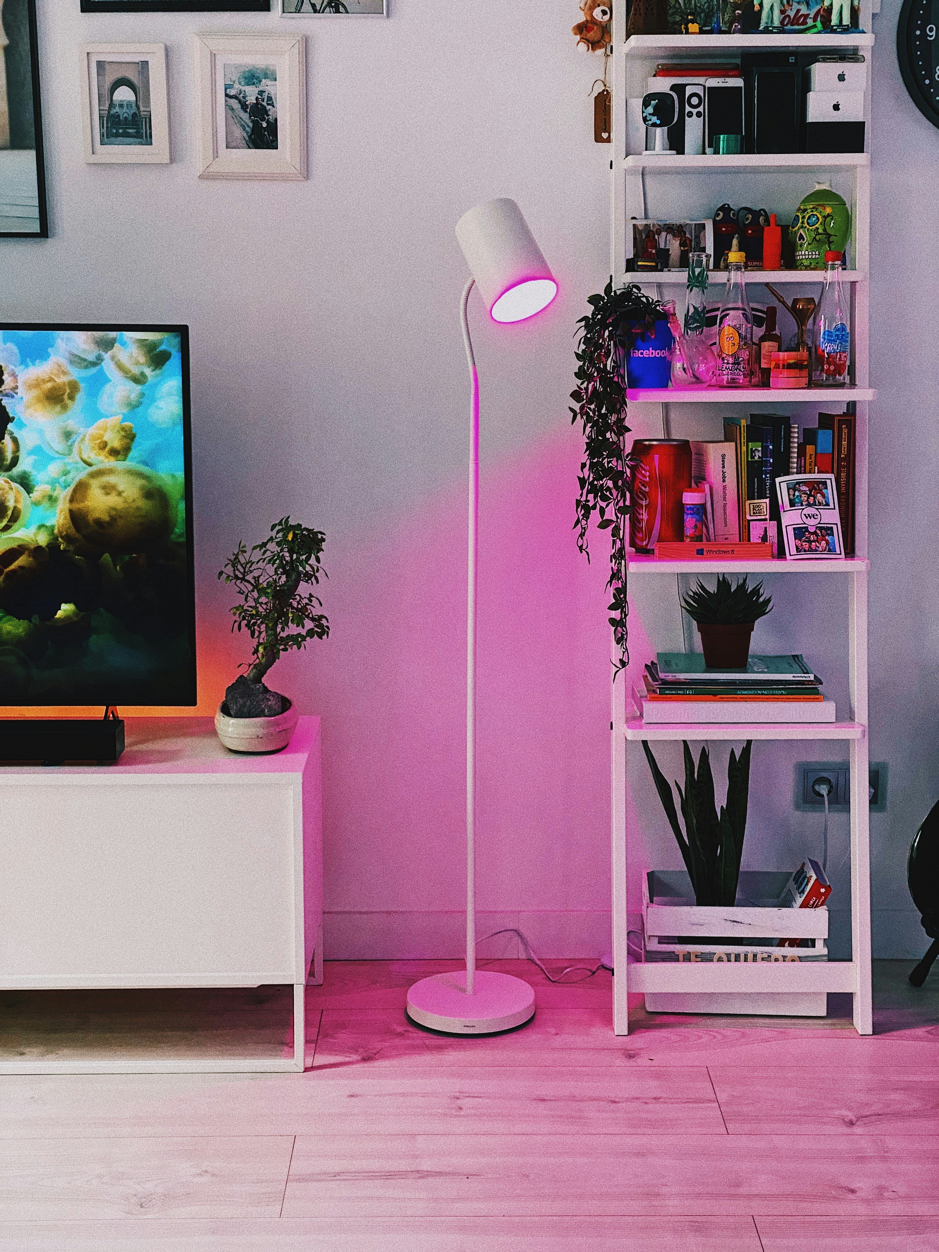 How to Decorate Your Space Inspired by Iconic Movie Sets – white and silver floor lamp beside white wooden shelf