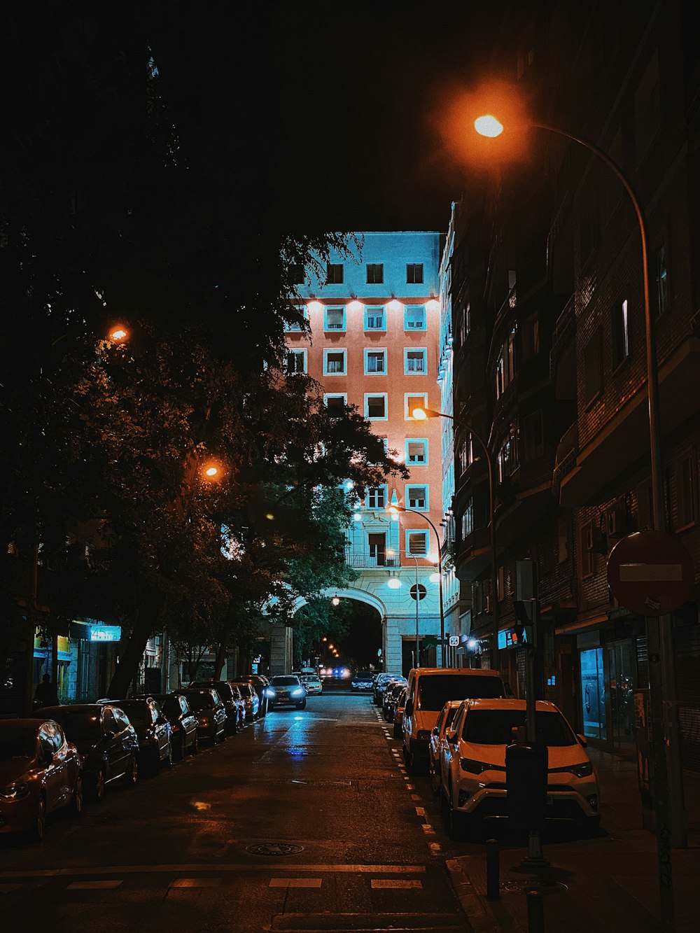 cars parked on street during night time