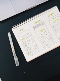 white and black pen on white paper