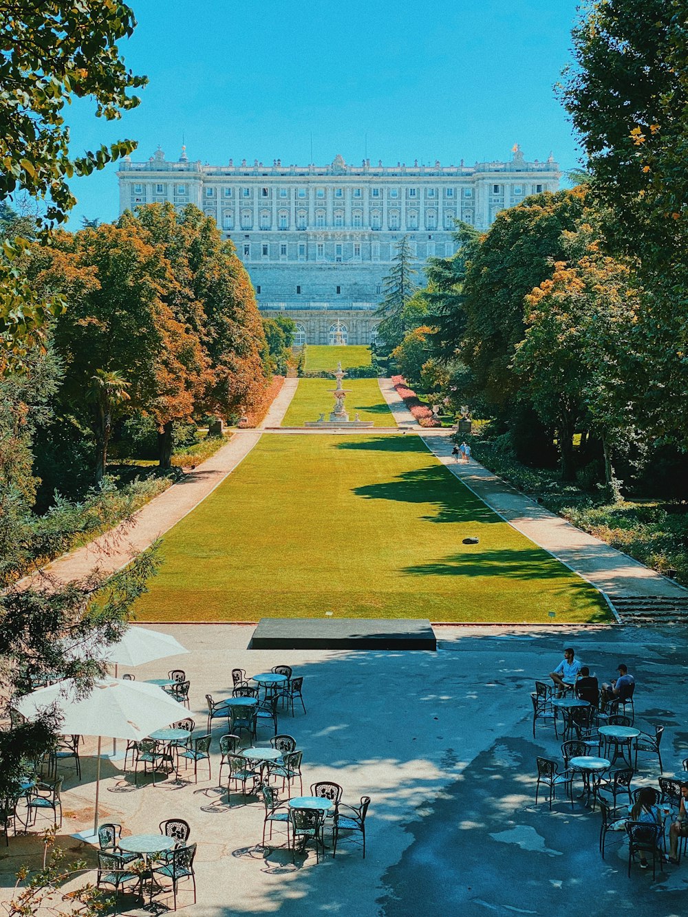 green trees near white building during daytime