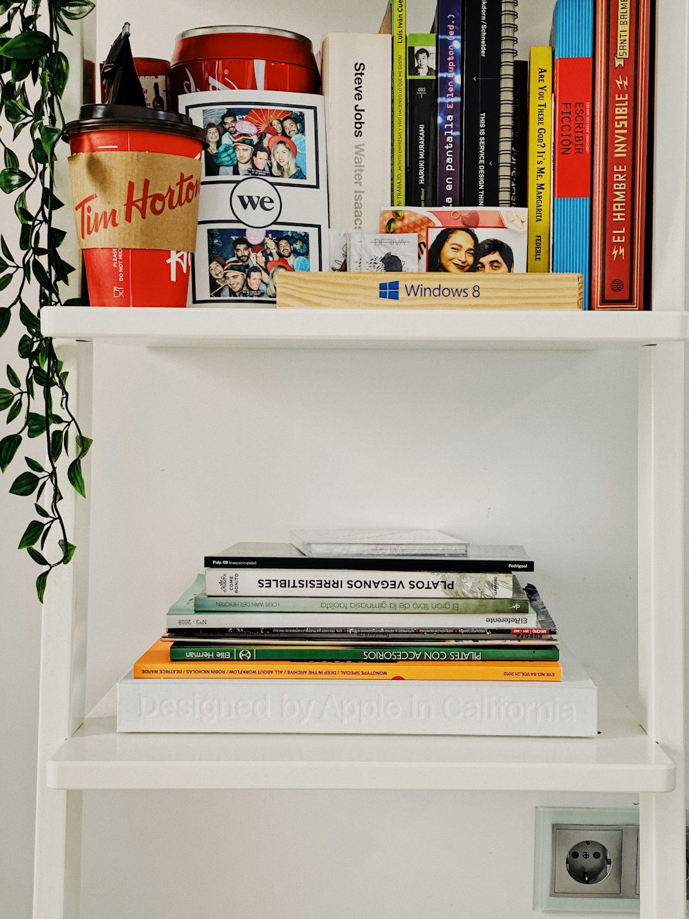 books on white wooden shelf