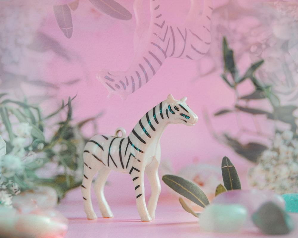 zebra figurine on brown wooden table