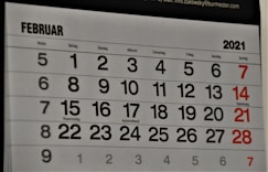 black and white calendar on white wall