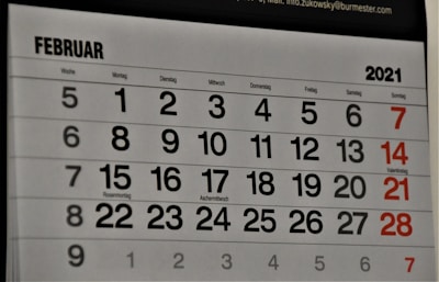 black and white calendar on white wall
