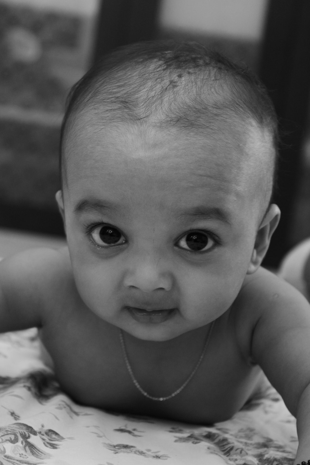grayscale photo of topless child