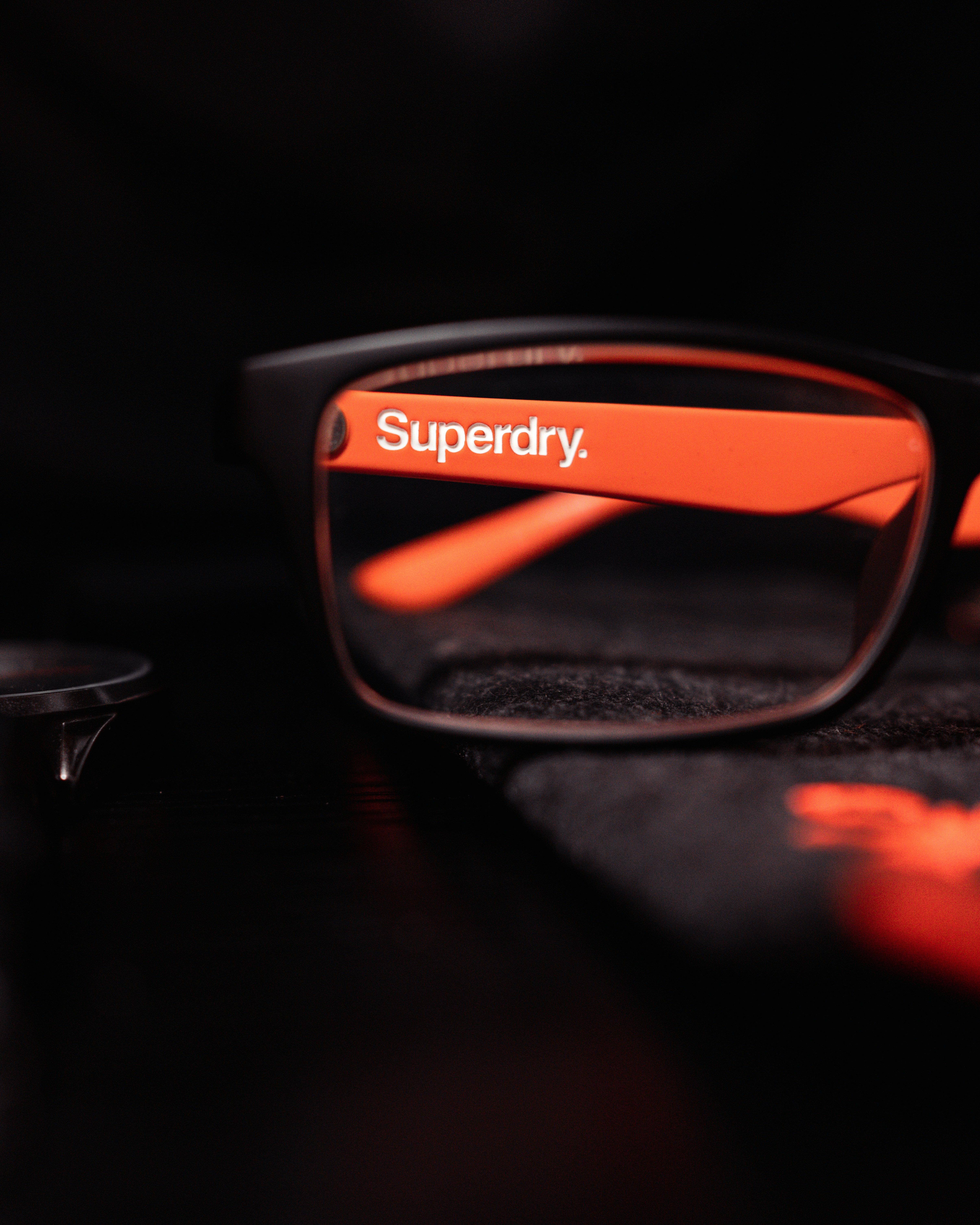 black framed eyeglasses on black textile