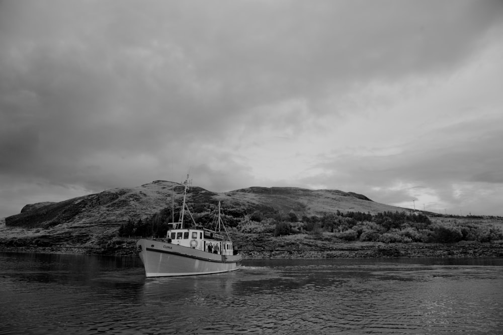 grayscale photo of boat on water