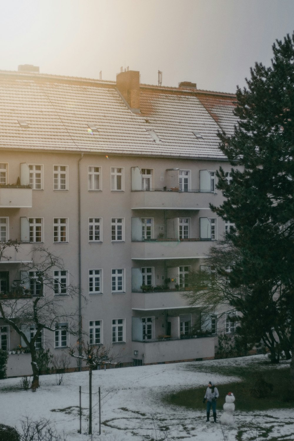 white concrete building near green trees during daytime