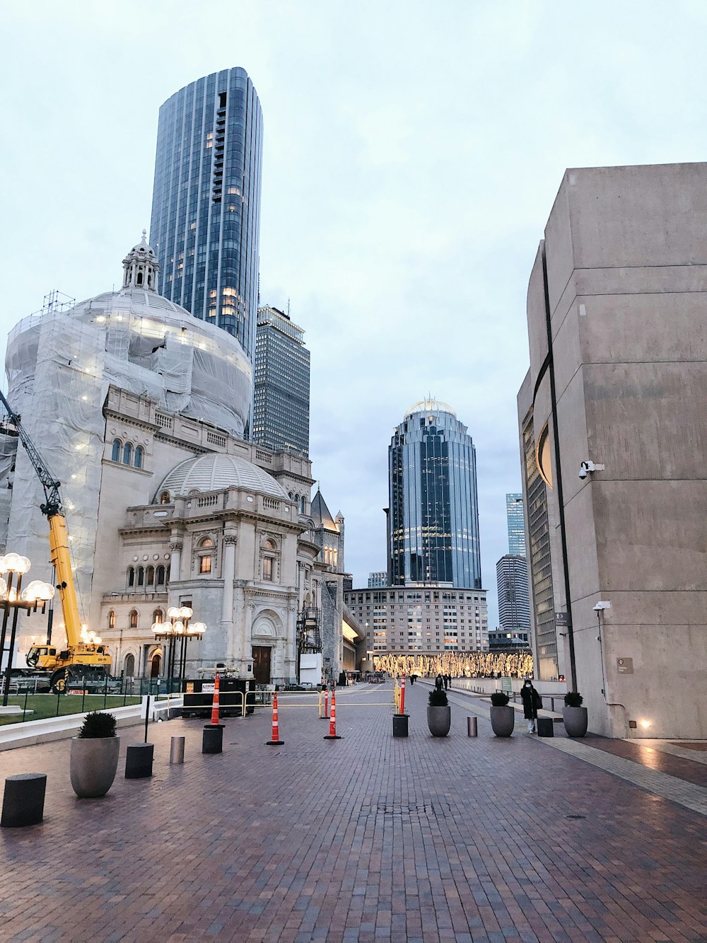 people walking on street near high rise buildings during daytime