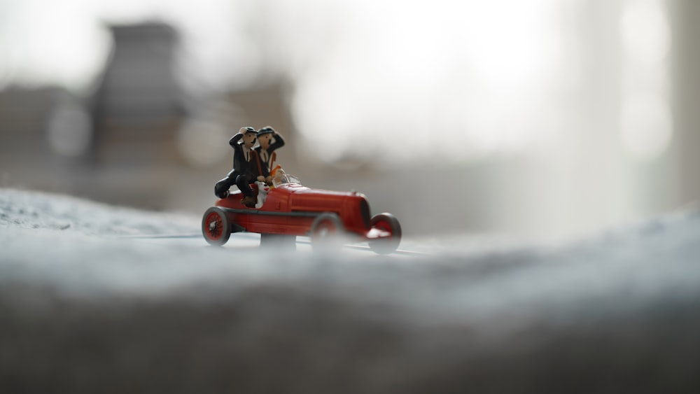red and black plastic toy car
