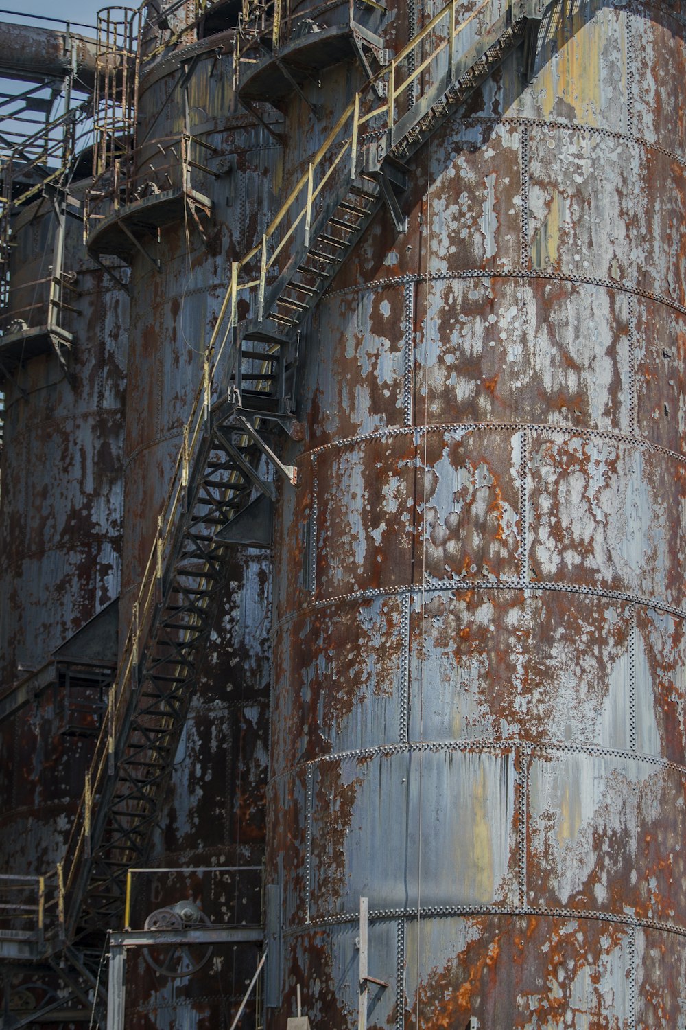 brown steel water tank on brown steel wall