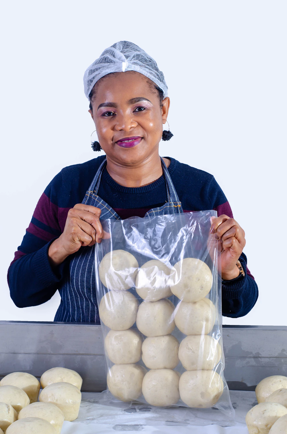 Small business owner holding her packaged product