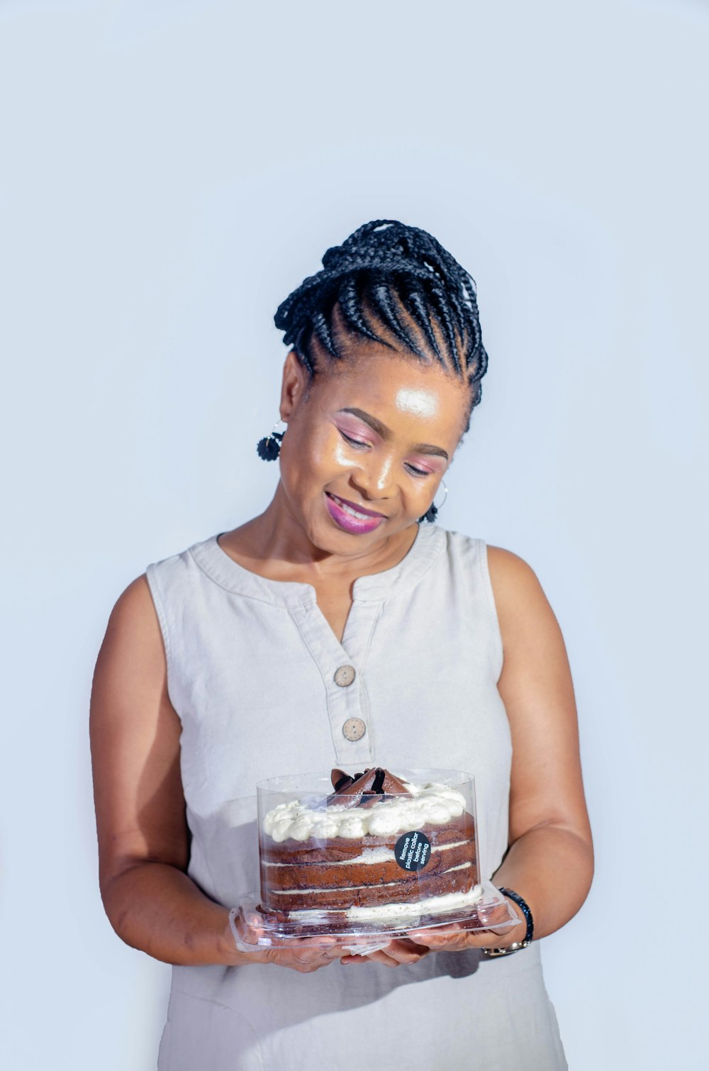 woman in white tank top holding ice cream