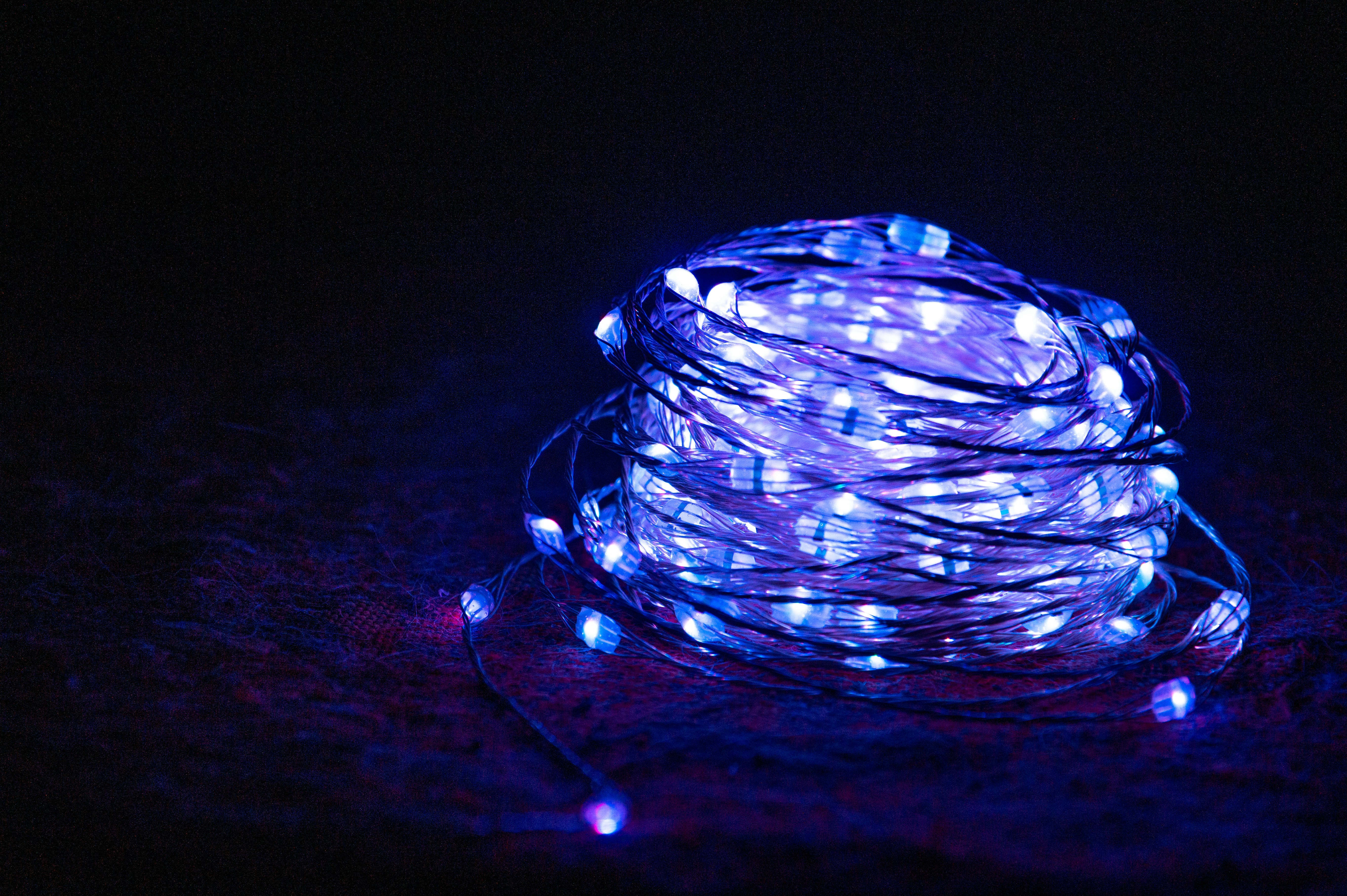 blue and white thread on black textile