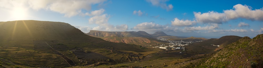 green and brown mountains under blue sky during daytime