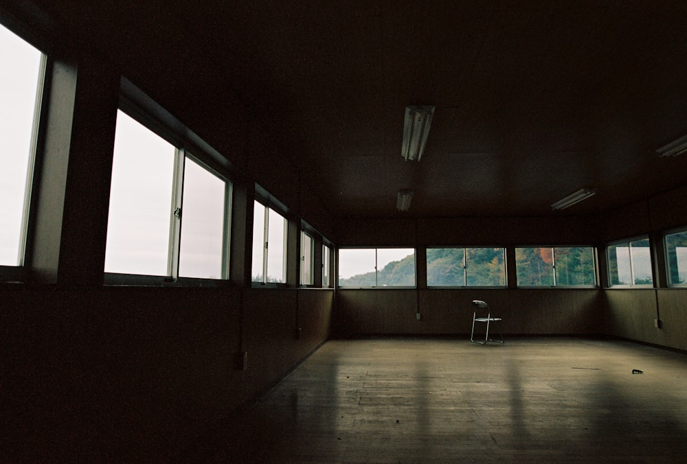 brown wooden floor and white wall