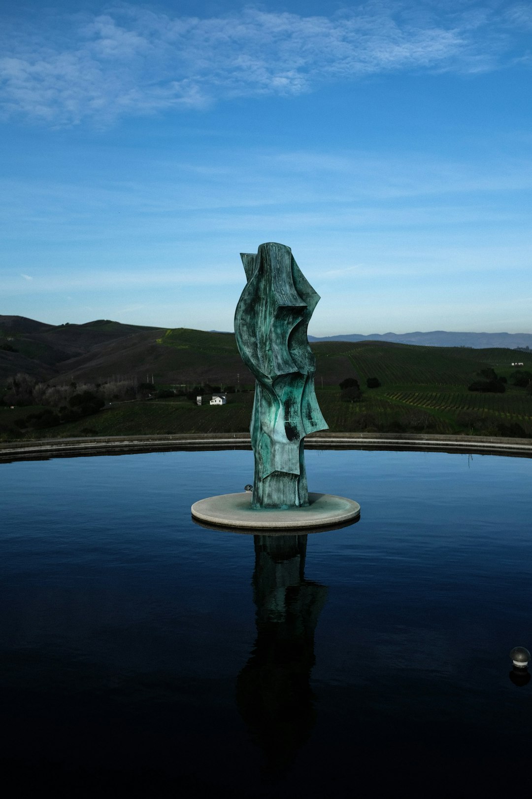 gray concrete statue on water