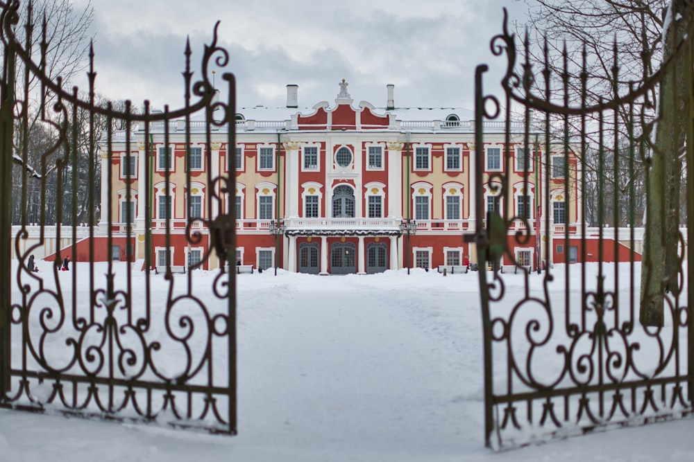 black metal gate covered with snow