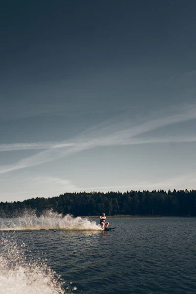 2 people riding on white kayak on lake during daytime