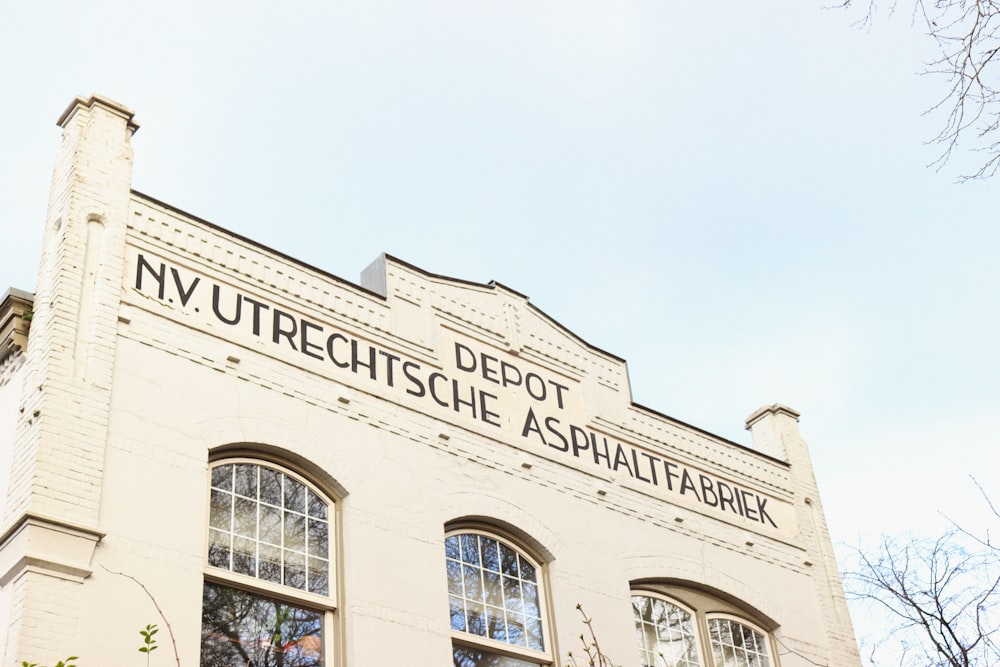 low angle photography of beige concrete building