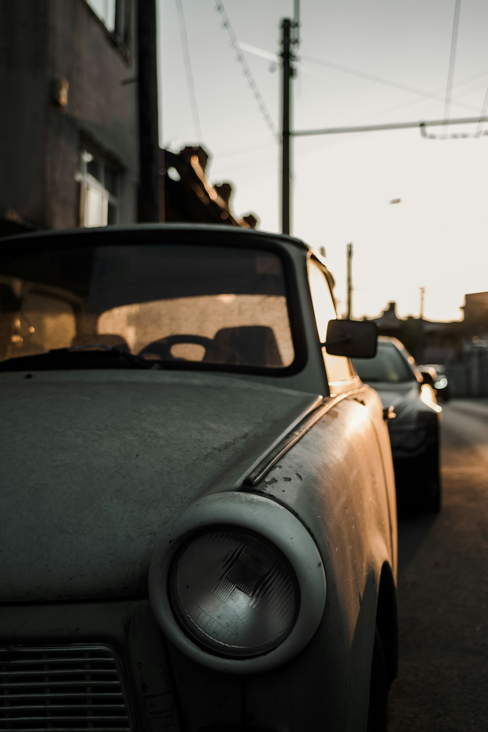 grey car parked on the side of the road