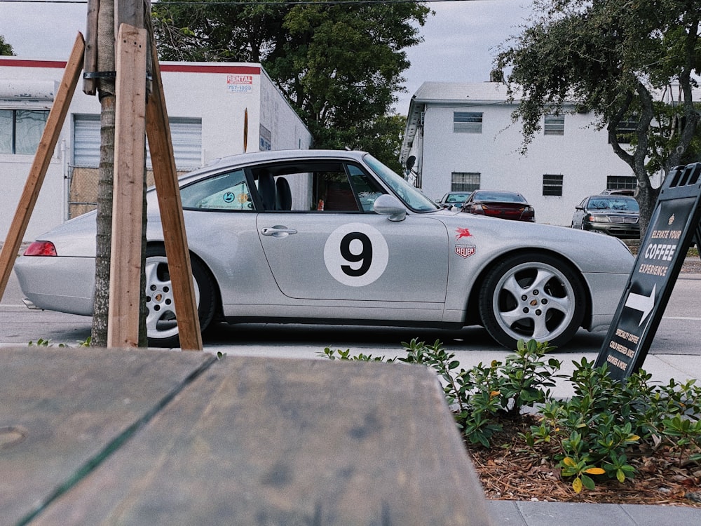 silver porsche 911 parked on parking lot during daytime