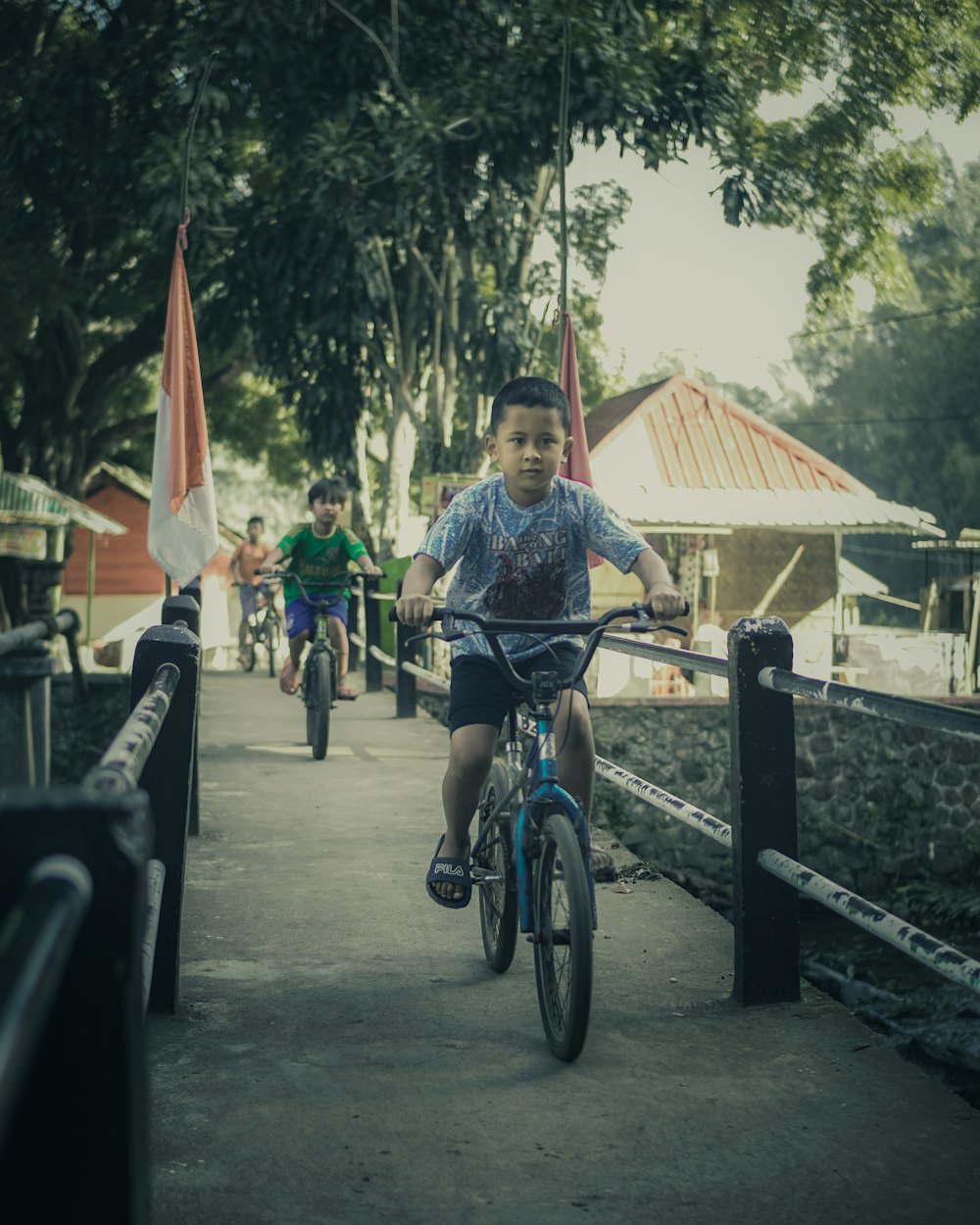 man in blue shirt riding bicycle during daytime