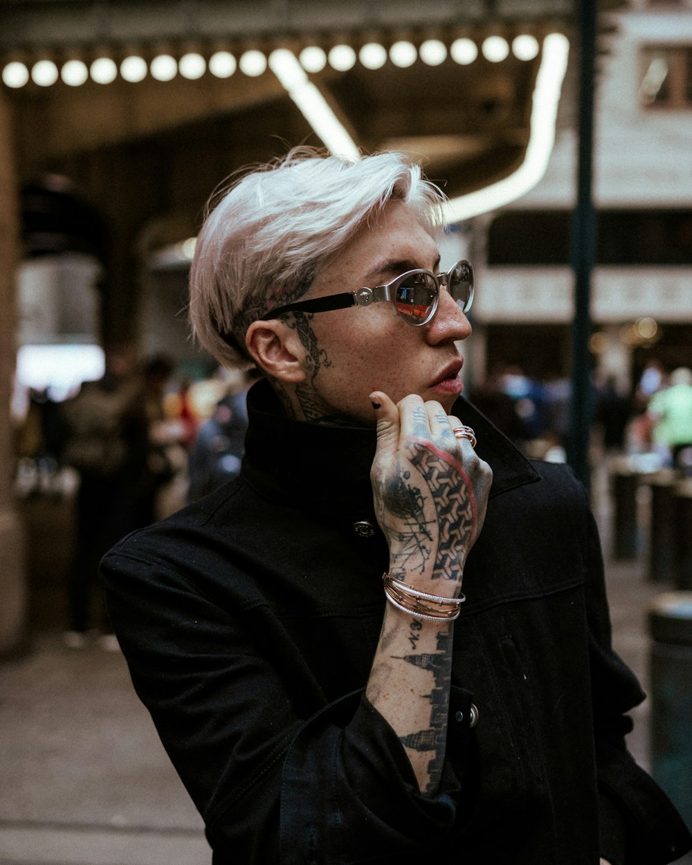 woman in black leather jacket wearing eyeglasses