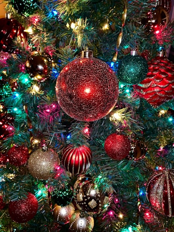 A vibrant Christmas card decorated with bright ornaments and twinkling fairy lights.