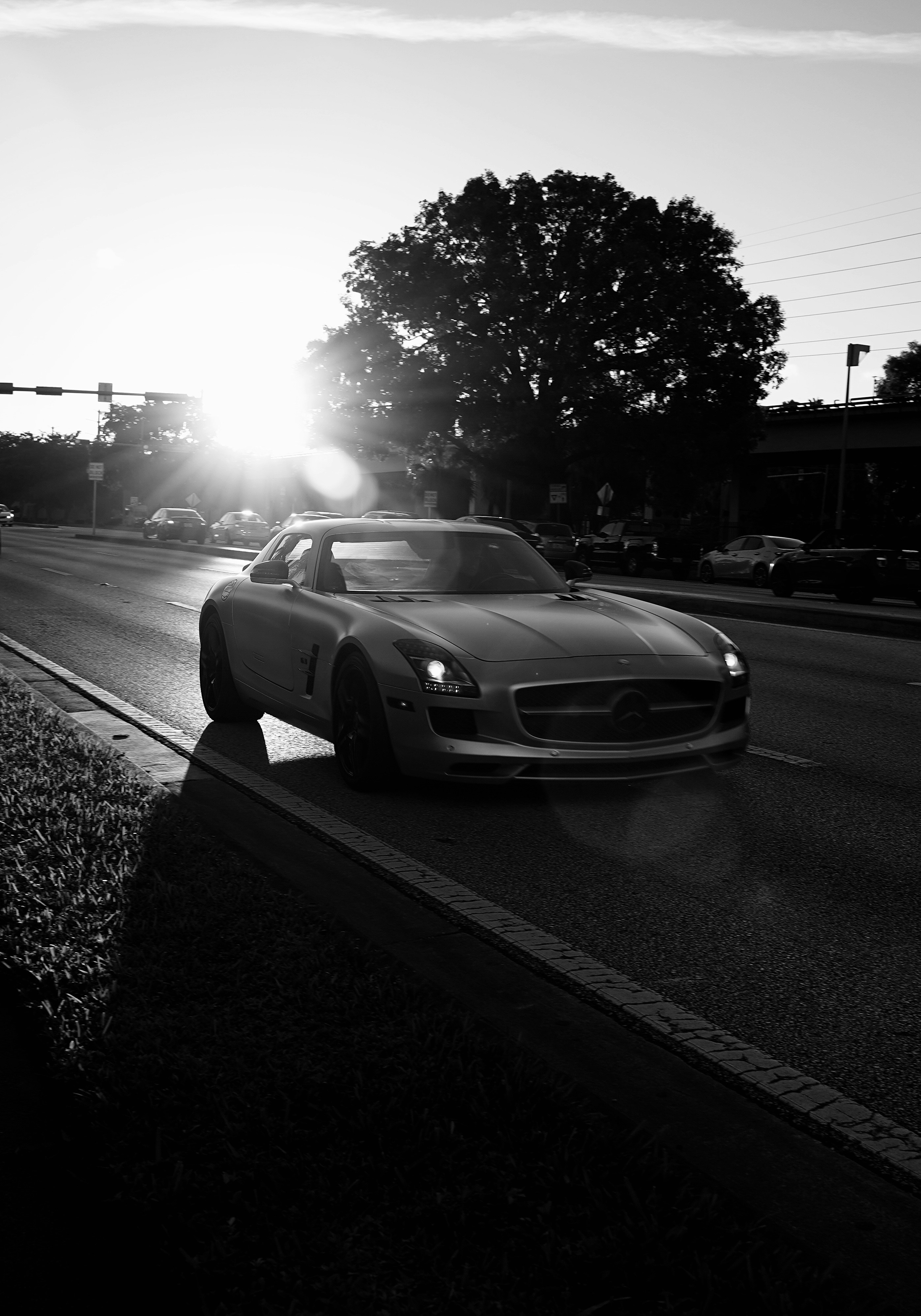 grayscale photo of car on road