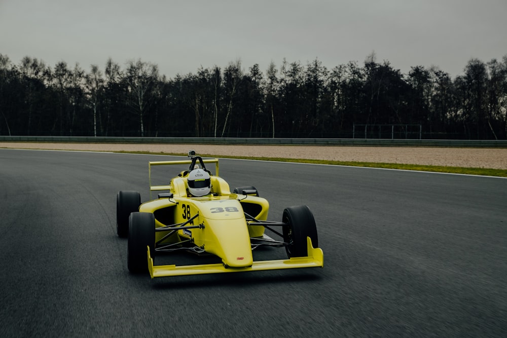 yellow and black go kart on gray asphalt road during daytime