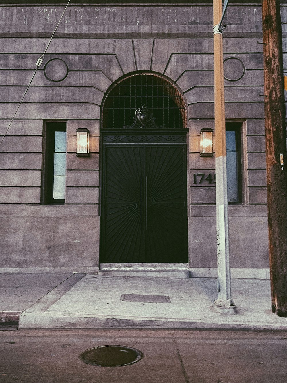 brown brick building with green door