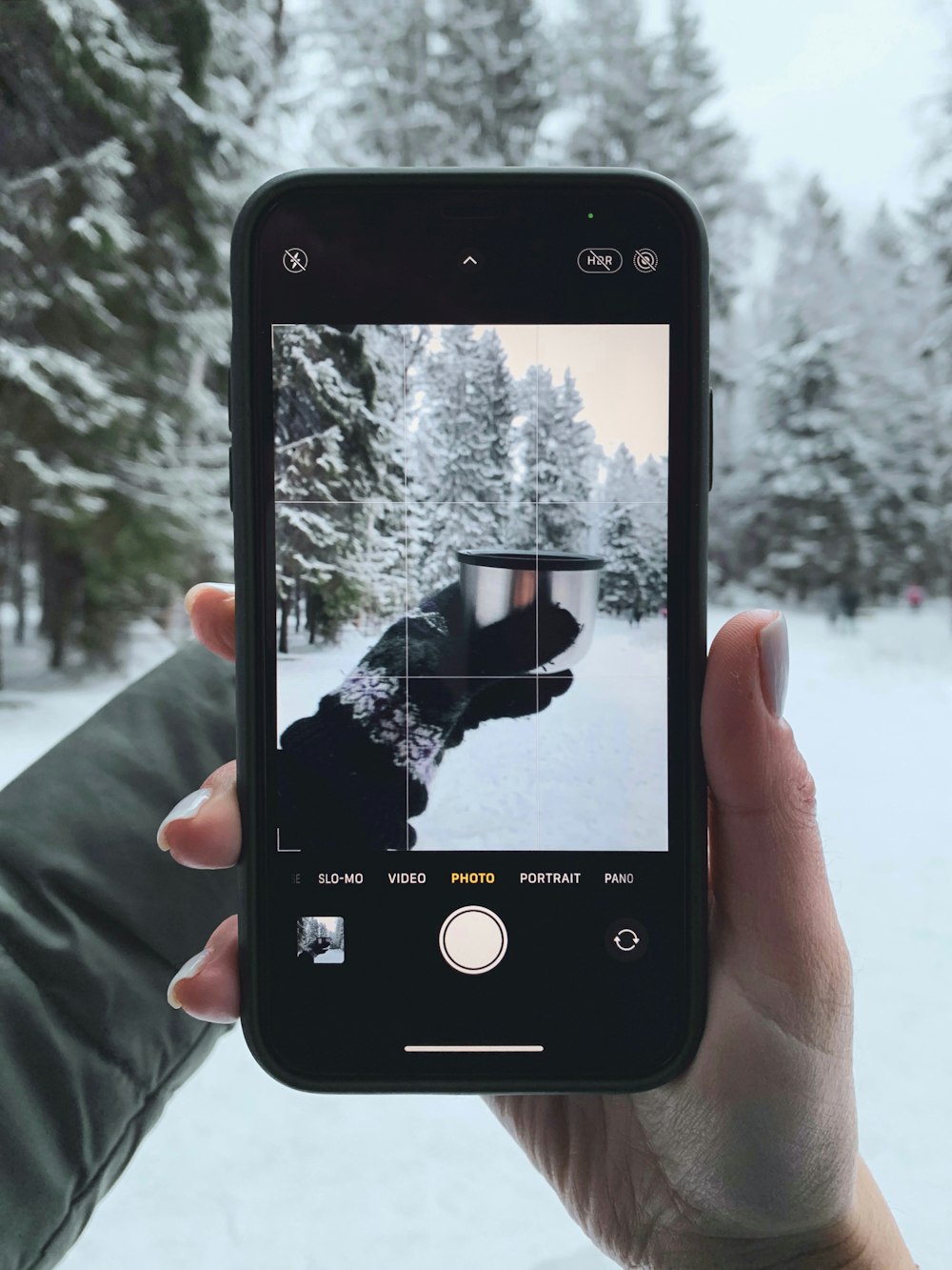 person holding black iphone 4