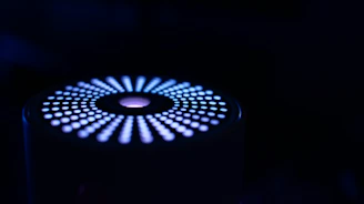 Abstract silicon wafer pattern glowing softly in deep navy tones.