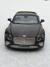 black mercedes benz c class on snow covered ground