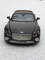 black mercedes benz c class on snow covered ground