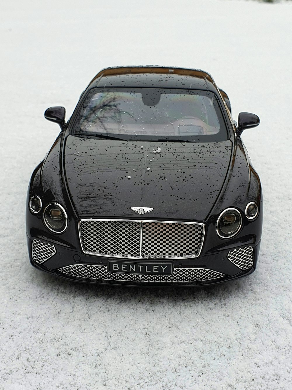 black mercedes benz c class on snow covered ground