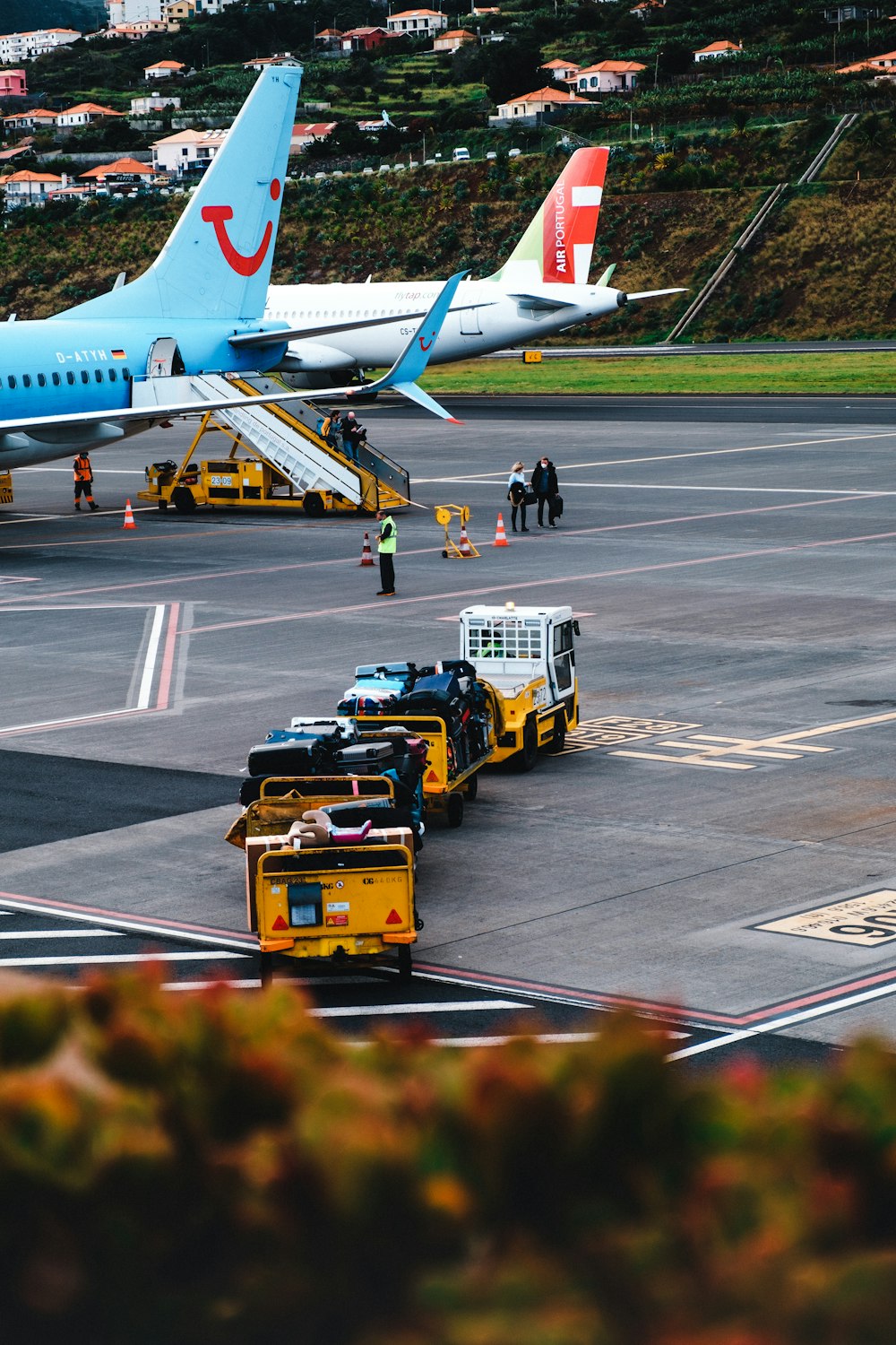 yellow and white passenger plane on airport during daytime