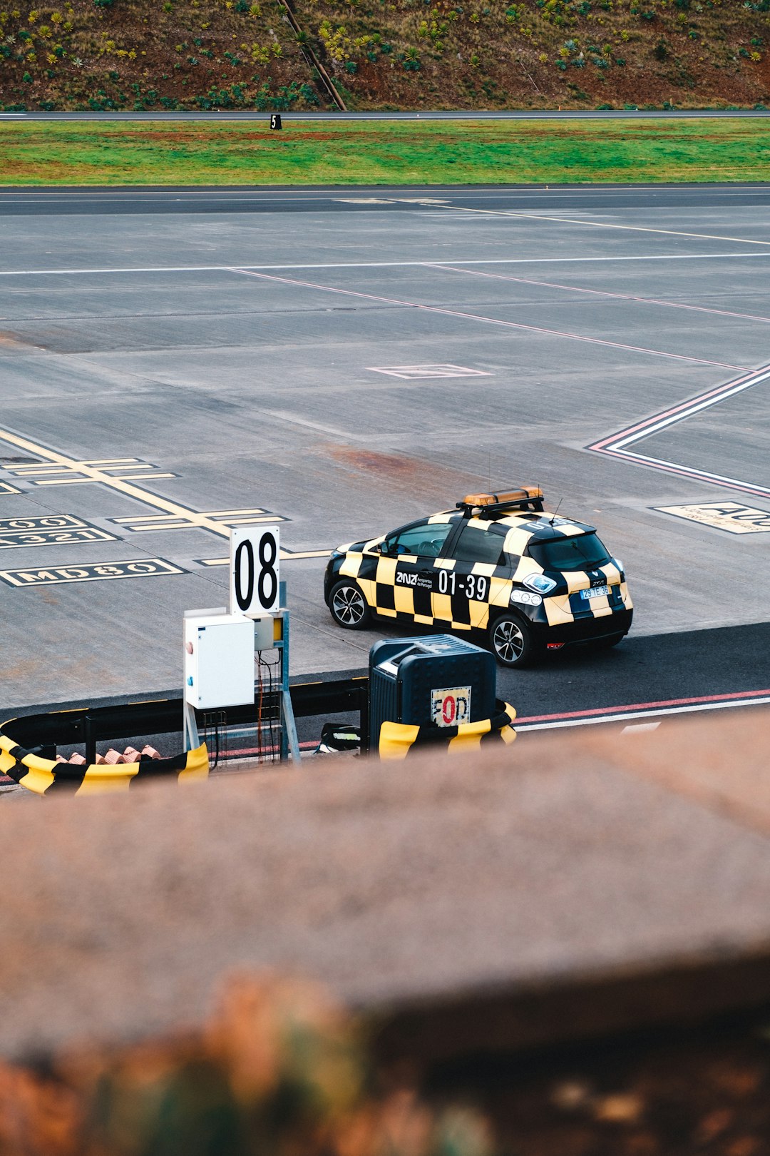 white and black police car on track