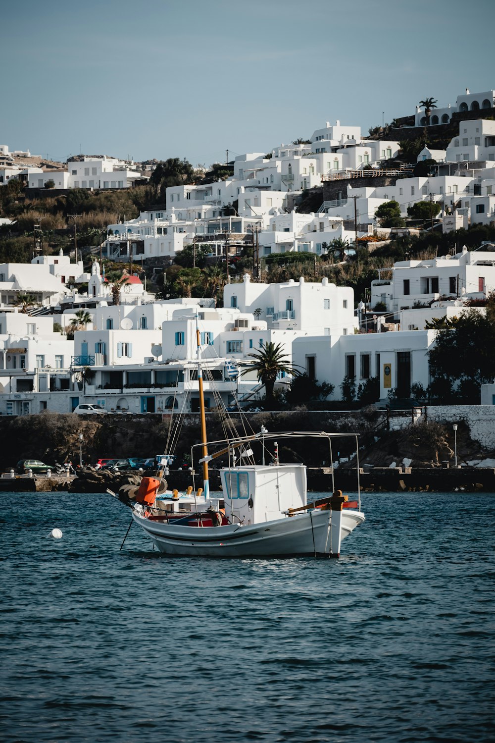 white and red boat on sea during daytime