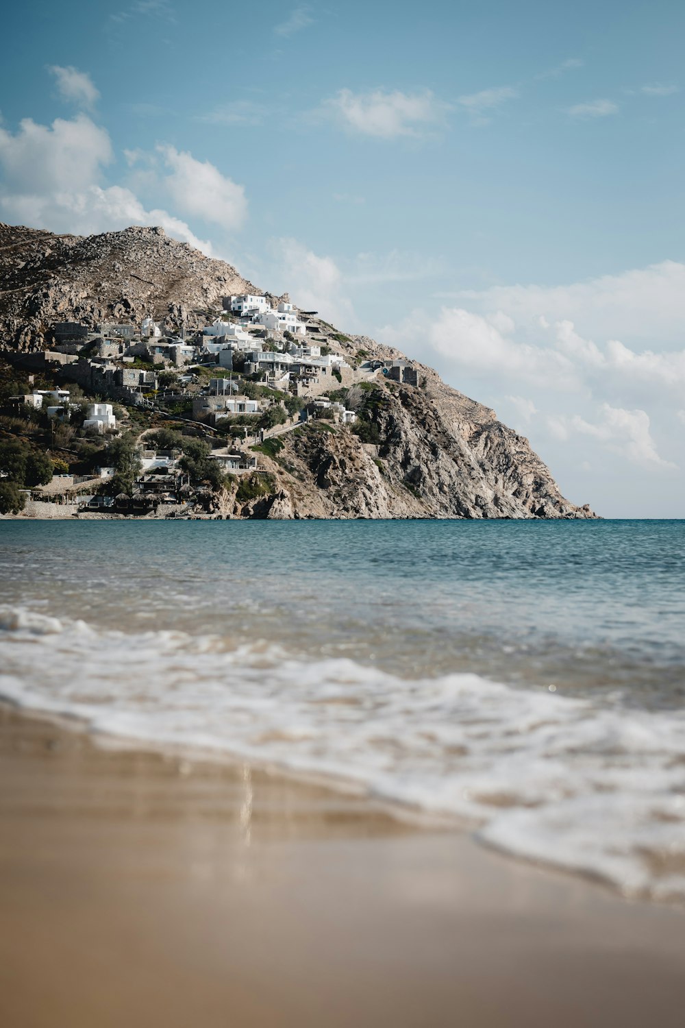 white and brown rock formation on sea shore during daytime