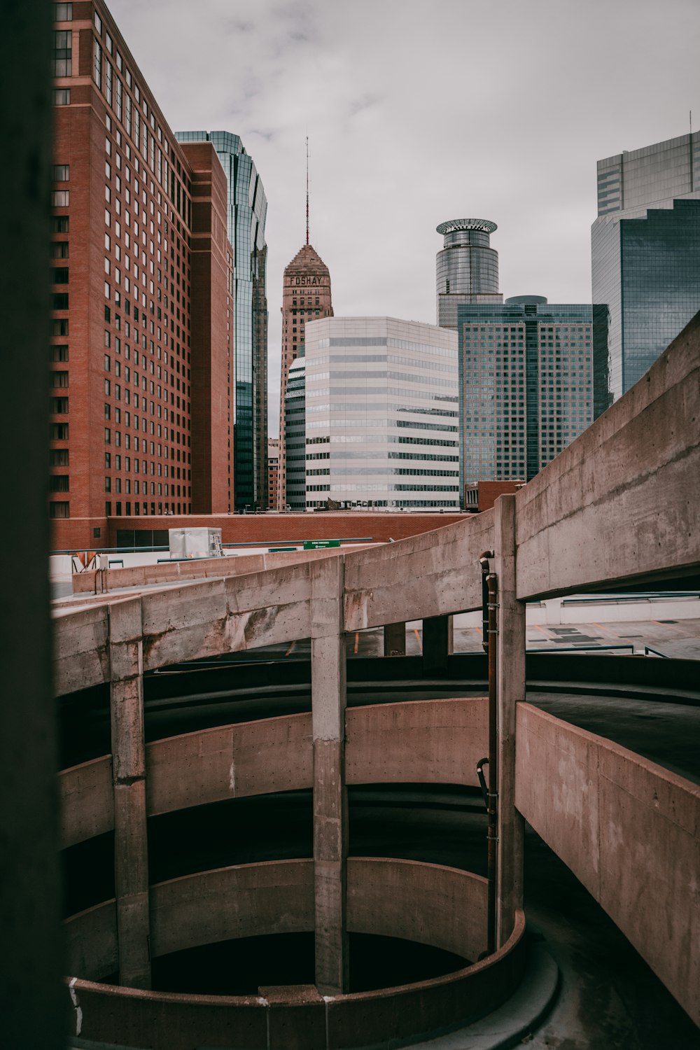 brown wooden boat on river near city buildings during daytime