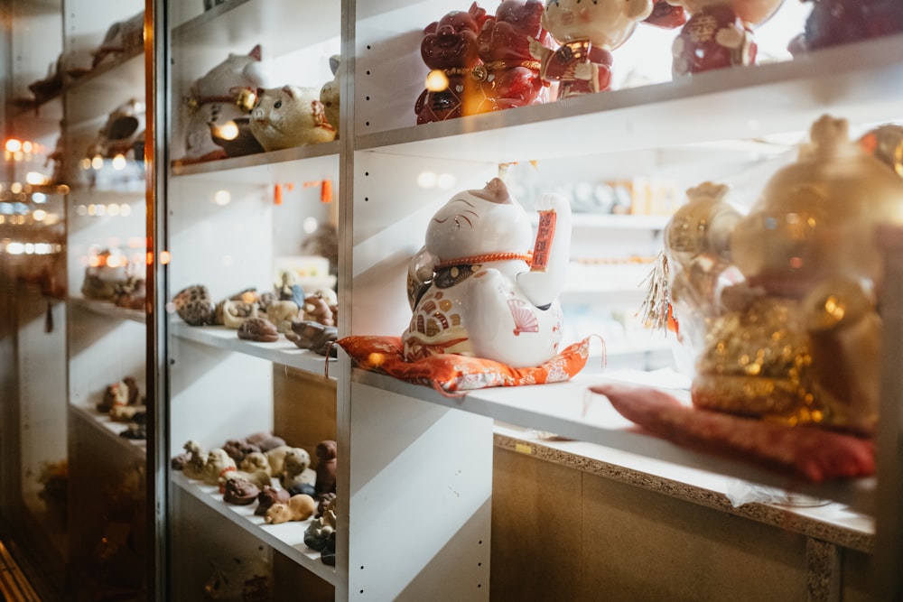 white and red ceramic figurines